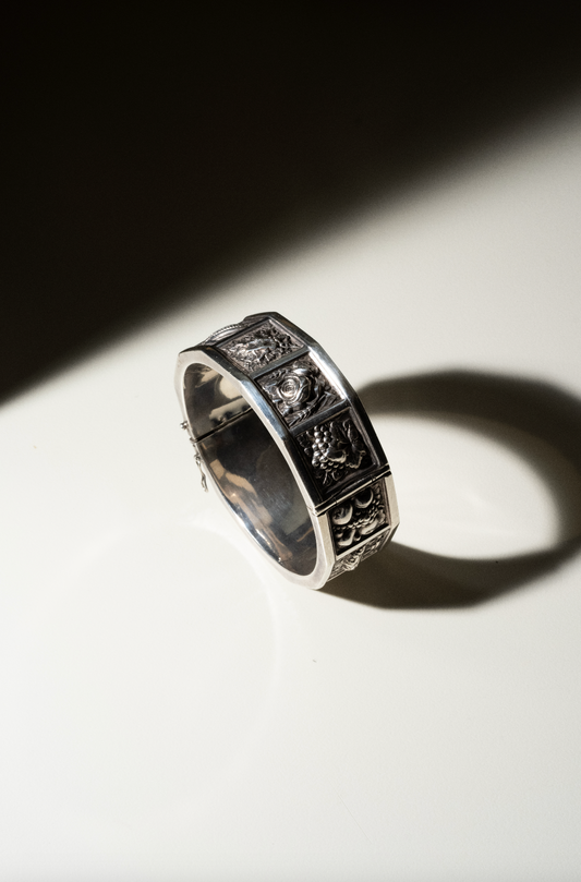 "1950s Handmade Silver Stamped Relief Bracelet Featuring Fruits and Vegetables"